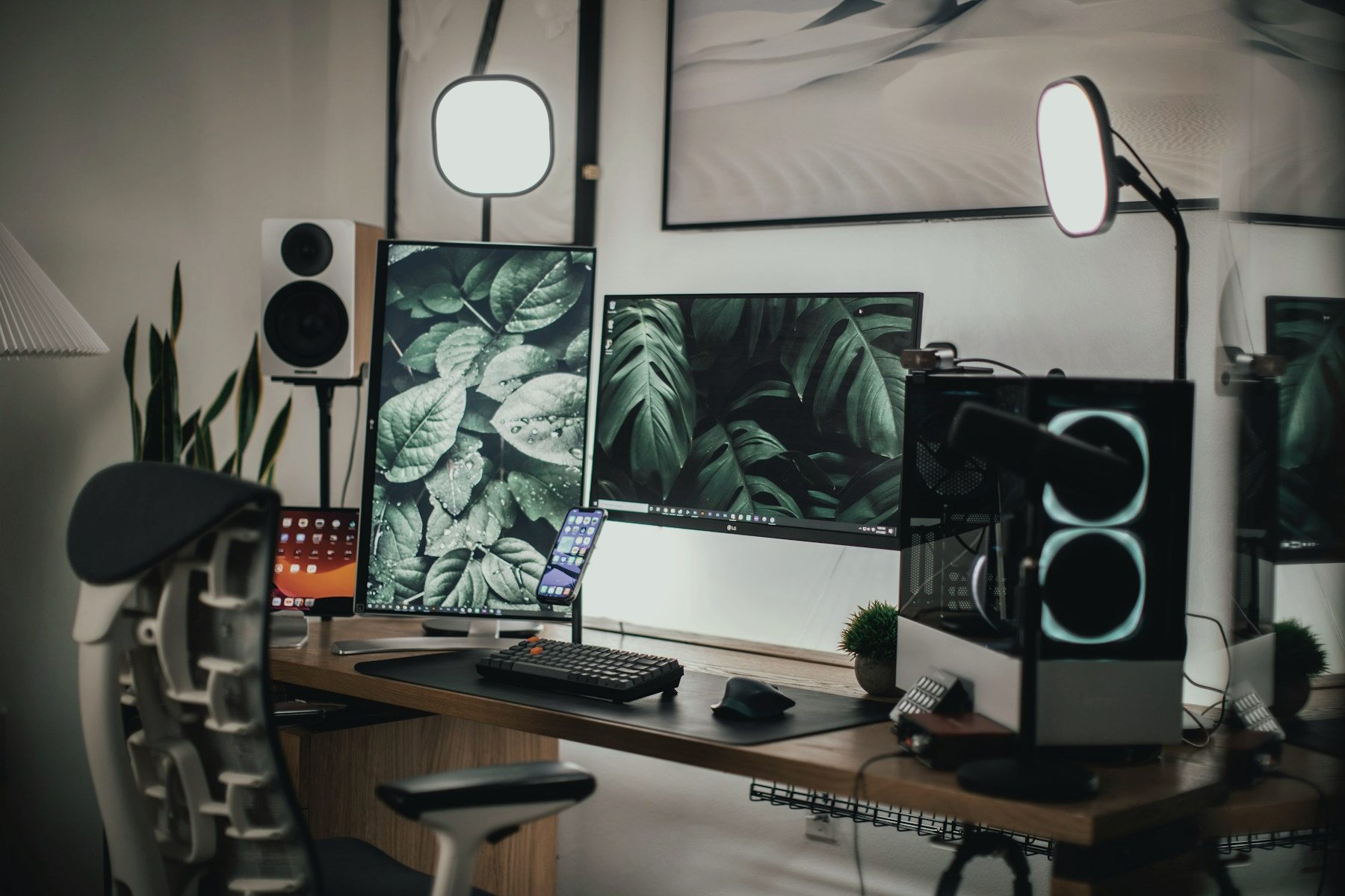 A clean desk with a monitor on a white table