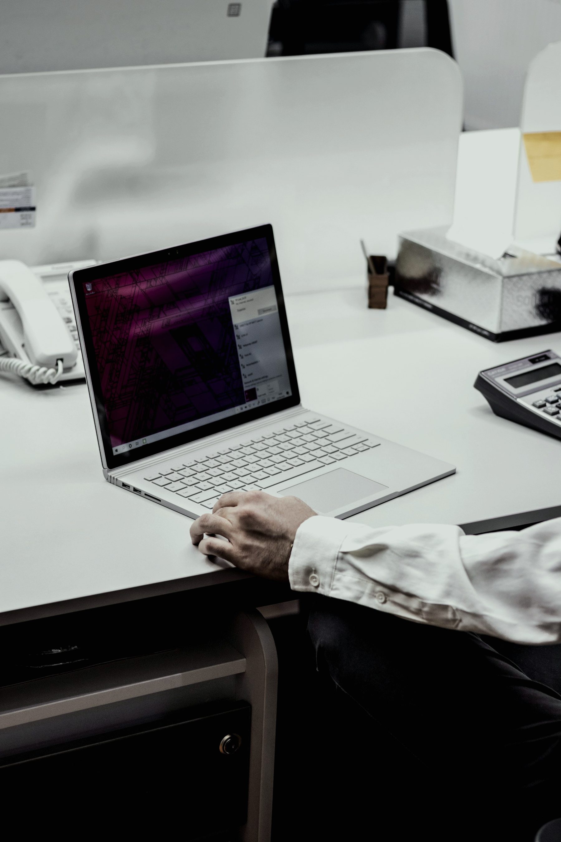 Working on a laptop in an office